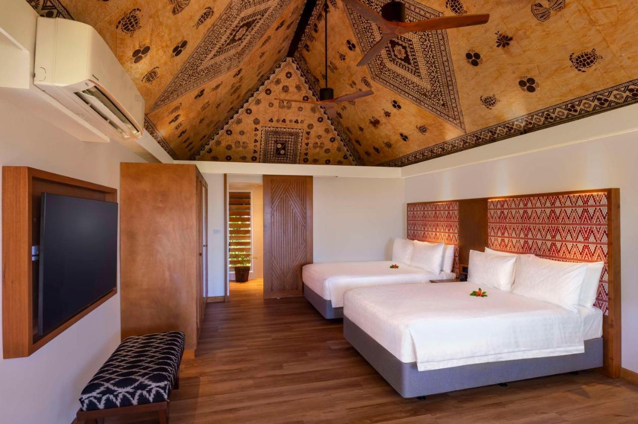 أوتريغر فيجي بيتش ريزورت كوروتوغو المظهر الخارجي الصورة A bedroom at the Sheraton Resort Fiji
